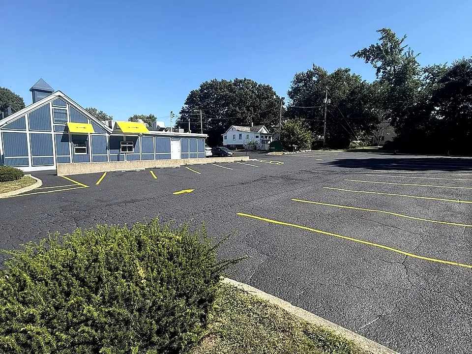 Parking-lot stall and directional lines, fresh paint